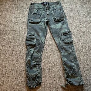 Camouflage Bubblegum rouched Jeggings with green sequin back pockets.